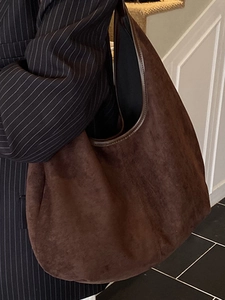 Minimalist large brown suede tote bag for women featuring a sleek shoulder strap design
