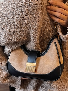 Chic two-tone hobo shoulder bag with beige suede, black leather trim and gold chain strap