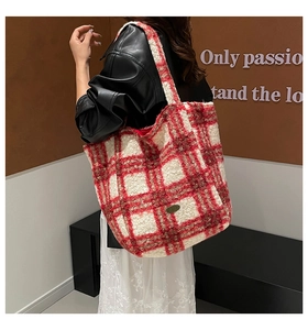 Detailed view of red and white plaid plush tote bag with soft lamb wool texture