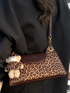 Vintage leopard print shoulder bag with brown leather flap and cute plush bear charm