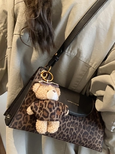 Vintage leopard print crossbody bag with black leather flap and cute bear pendant charm