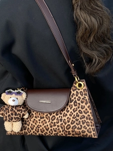 Vintage leopard print shoulder bag with brown leather flap and stylish bear charm