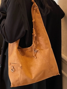 Orange-braune Hobo-Schultertasche aus Wildleder mit Kordelzug-Details für den Alltag