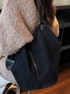 Retro black oversized bucket tote bag with matte leather finish and glossy strap details