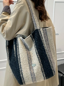 Striped plush tote bag in black, gray and white vertical patterns for winter style