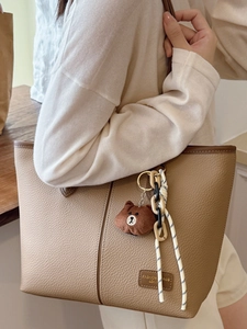 Vintage large capacity brown tote bag with leather texture and stylish accessories