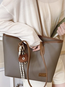 Vintage large-capacity grey shoulder tote bag with brown contrast trim and bear charm
