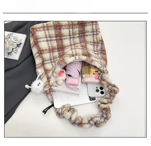 Top view of plush checkered tote bag interior showing large capacity for daily items