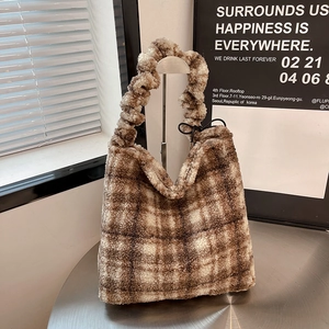 Detailed view of plush lamb wool tote bag with brown and white checkered pattern design