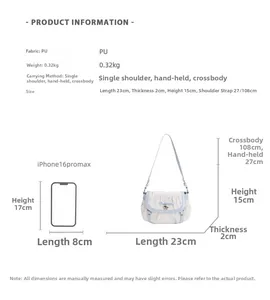 Size comparison of the white quilted bow bag with iPhone showing 23x2x15cm dimensions