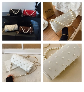 Detail of elegant barrel bag with decorative pearl handles and matrix pearl accents