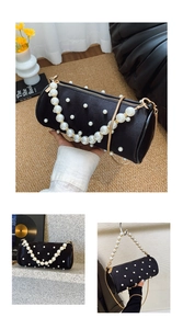Detail of black velvet cylinder bag featuring pearl embellishments and golden chain