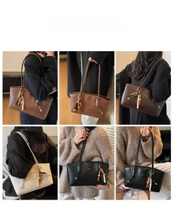 Detail view of woven texture shoulder bag with decorative wooden bead tassel pendant
