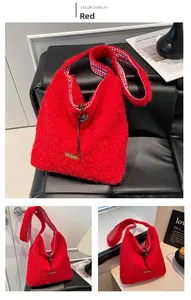 Detail of red plush hobo bag showing plaid lining and brown drawstring closure