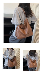 Detailed close-up of brown PU leather tote bag showing fine texture and front pocket