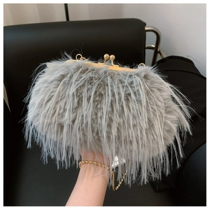 Close-up of grey faux fur evening bag featuring golden clasp and beaded chain strap