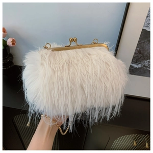 Detail shot of white turkey feather clutch bag with gold metallic frame and bead chain