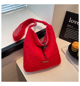 Detail view of red plush tote bag with drawstring closure and checkered fabric lining