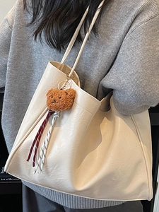 Vintage cream white faux leather tote bag with cute plush bear charm for daily commuting
