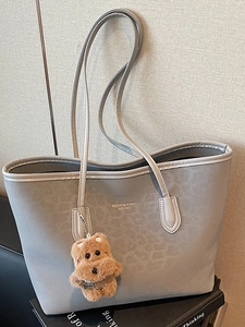 Retro grey faux leather tote bag with snakeskin texture and cute plush puppy charm