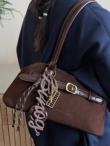Retro coffee brown frosted leather tote bag with stylish charms and buckle detail
