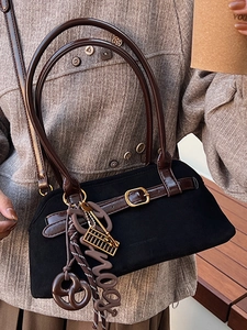Vintage black hobo bag with brown leather straps and metallic abacus pendant detail