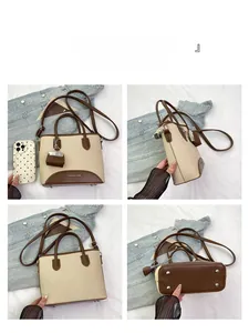 Detailed views of the retro beige fabric bucket bag with brown leather trim and metal feet