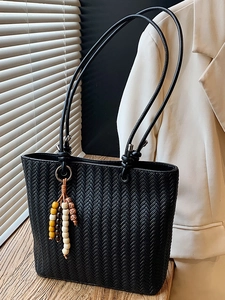 Chic black woven texture tote bag with long straps and wooden bead pendant for women