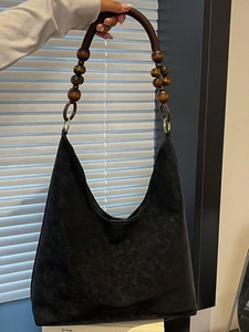 Minimalist large black suede shoulder bag with retro wooden bead handle for daily commute