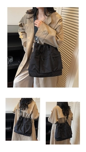 Detail view of black nylon drawstring tote bag with multiple utility pockets and strap