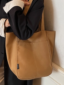 Waterproof nylon tote bag for women in dark brown featuring front double pockets and fashion label