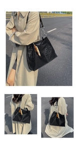 Outdoor lifestyle view of black leopard print tote bag with chain strap and beads