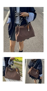 Brown leopard print tote bag featuring metallic chain strap and boho tassel charm detail