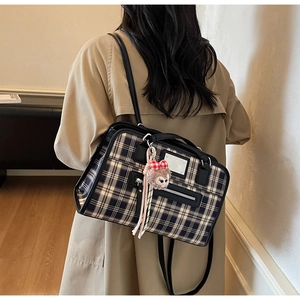 Classic blue and beige plaid tote bag with black leather straps and plush charm detail