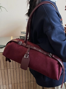 Minimalist burgundy suede baguette shoulder bag with leather strap and silver buckle detail