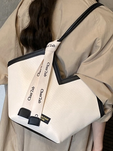 Retro large capacity tote bag in cream white with black trim and unique V-neck opening
