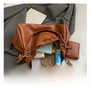 Macro detail of brown tote bag interior showing large capacity for tablet and phone
