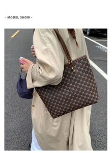 Outdoor street view of the large capacity dark brown tote bag with geometric pattern