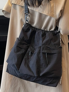 2025 trendy black nylon crossbody bag with large capacity pockets and drawstring closure