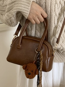 Vintage brown PU leather bowling bag with teddy bear charm and braided rope detail