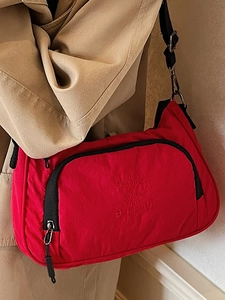 Retro red nylon crossbody bag with pleated texture and adjustable strap for women
