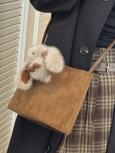 Minimalist brown suede crossbody bag with cute plush animal charm for casual daily wear