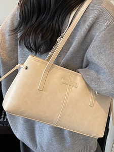 Fashionable beige leopard print hobo bag with vintage texture and drawstring details
