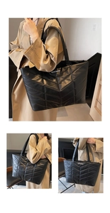 Detail of black quilted tote bag with V-shaped stitching and white letter branding
