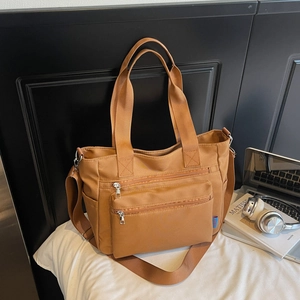 Caramel large nylon tote bag with multi-pocket details and adjustable shoulder strap