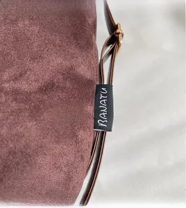 Macro view of brown suede tote bag featuring reinforced stitching and RANATU brand label