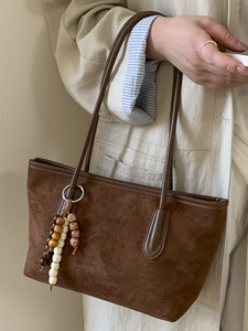 Classic dark brown suede tote bag with beaded tassel charm and long leather handles