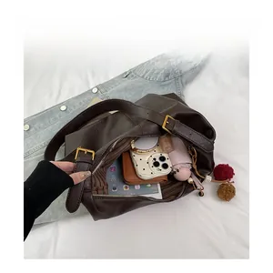 Detail view of large capacity tote bag interior with multiple compartments and accessories