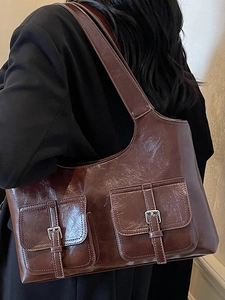 Large dark brown shiny faux leather tote bag with vintage silver buckles for work
