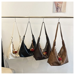 Chic hobo shoulder bags in white, black, coffee and caramel with plush ball pendants